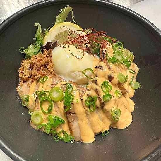 Aburi bowl at Gyo Gyo En with seared salmon, soft-boiled egg, scallions and miso aioli