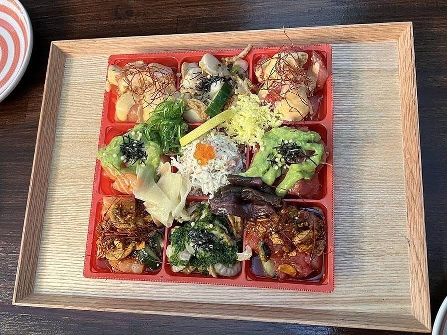 Nine-compartment shokado bento box at Gyo Gyo En with five kinds of poke and chef's choice sides